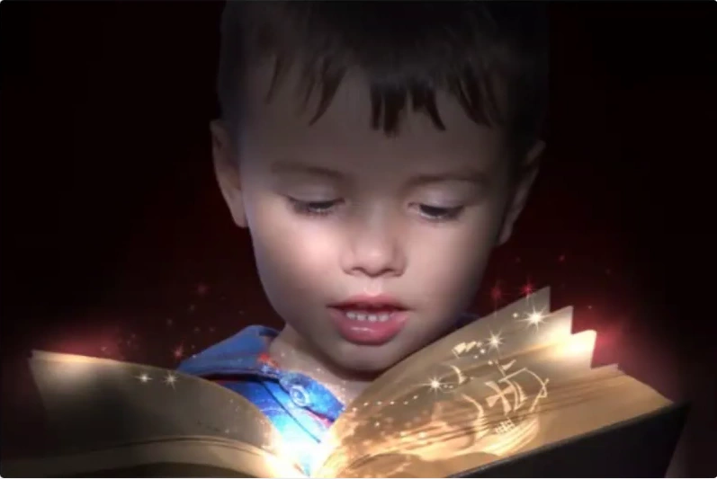 File:Ali boy reading a magical book.webp