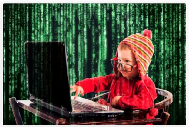 File:Ali boy using laptop infornt of grren computer like background.webp